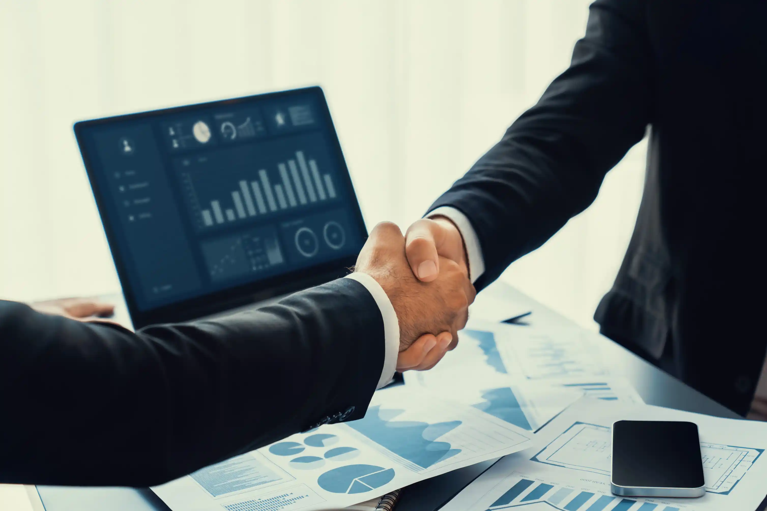 Strategic partners shaking hands on affiliate partnership agreement