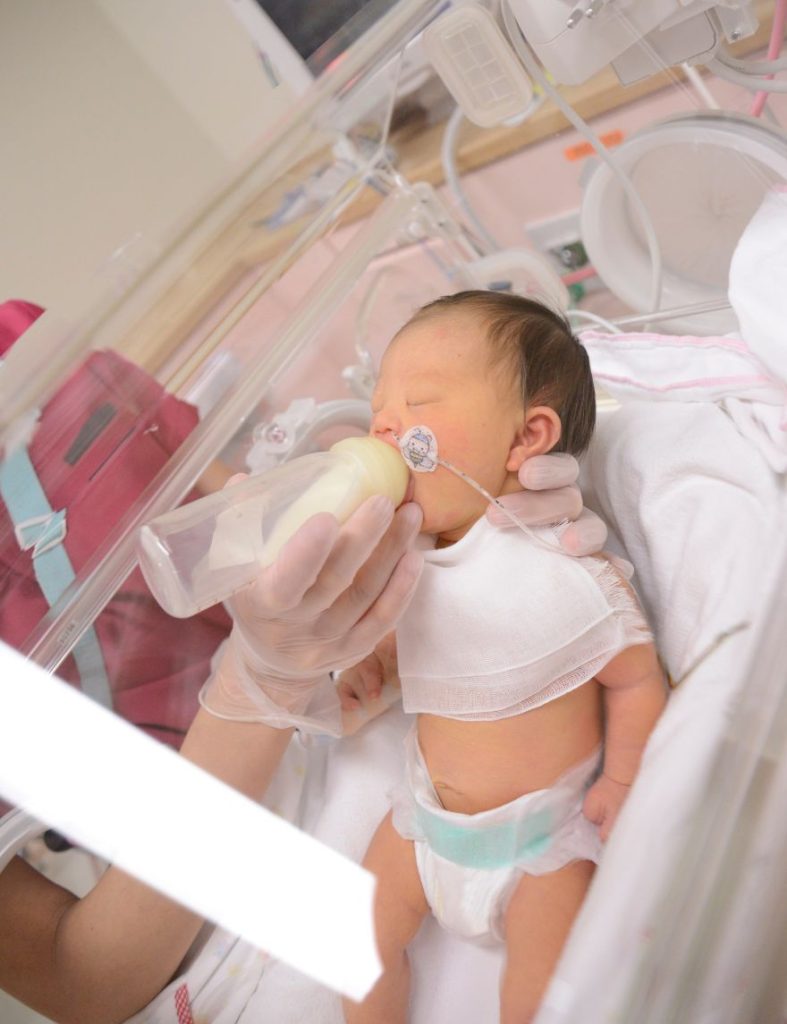 Birth mother holding her baby before placement